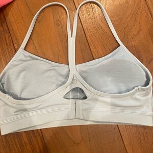 Lululemon women’s size 12 light blue/grayish sports bra with clasp in back.